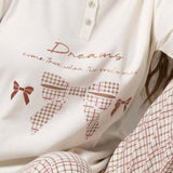 Pigiama donna in caldo cotone con stampa Dreams e pantaloni a quadri - MILK - TE16